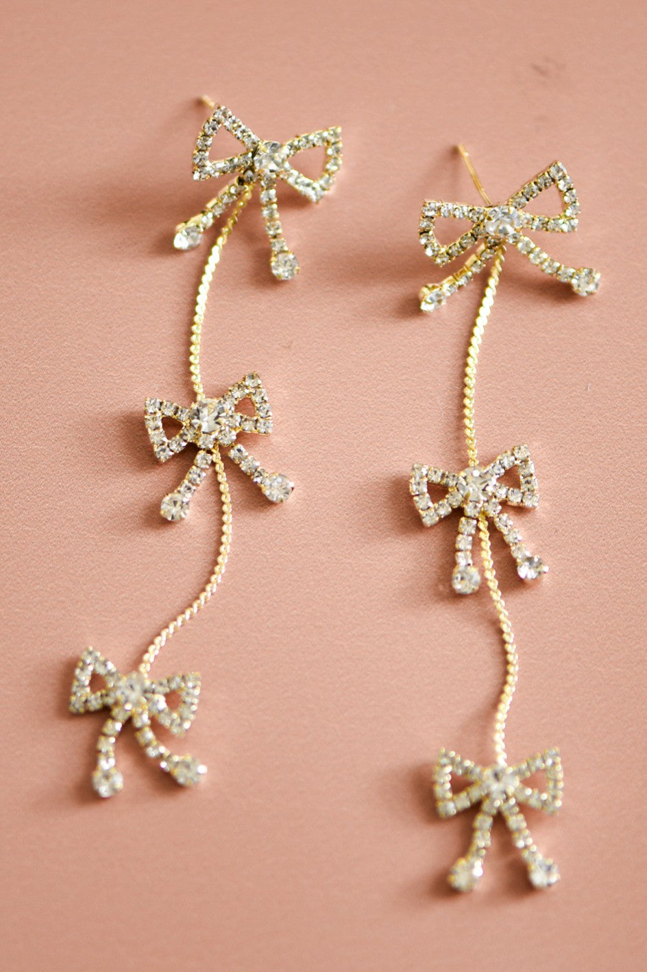 long pave bow earrings