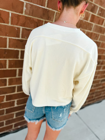 cream cropped crewneck sweatshirt w/ raw hem