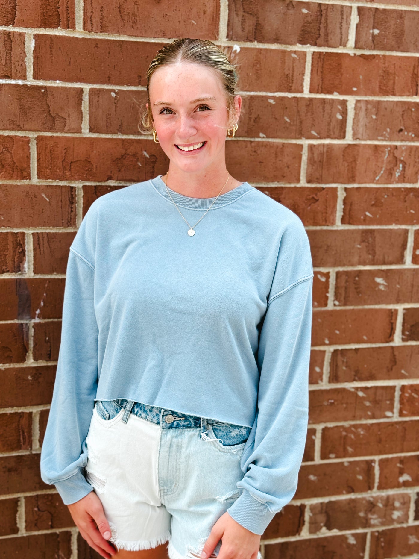 blue cropped crewneck sweatshirt w/ raw hem