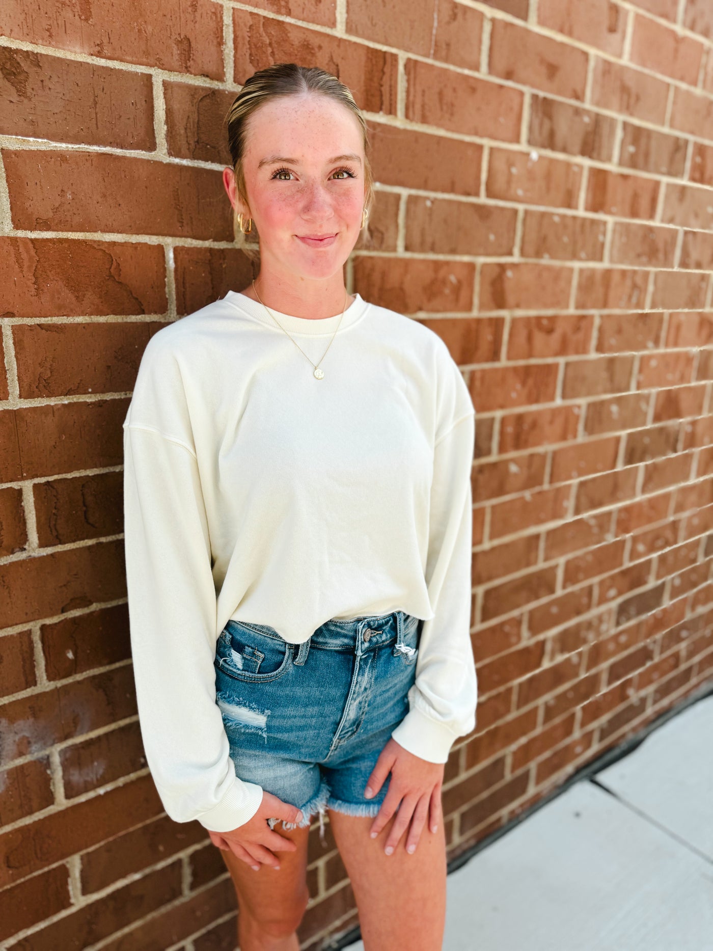 cream cropped crewneck sweatshirt w/ raw hem