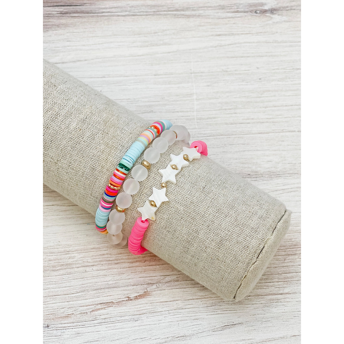 stars and pink beaded bracelets