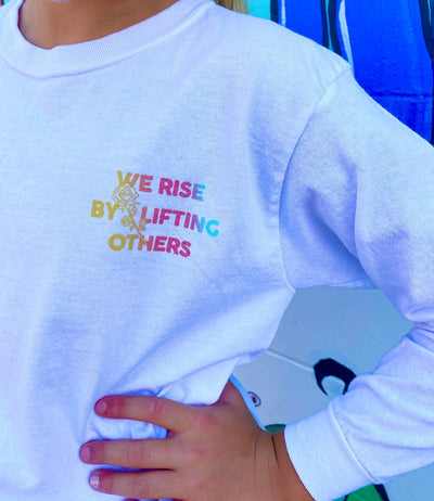 WE RISE BY LIFTING OTHERS LS WHITE TEE
