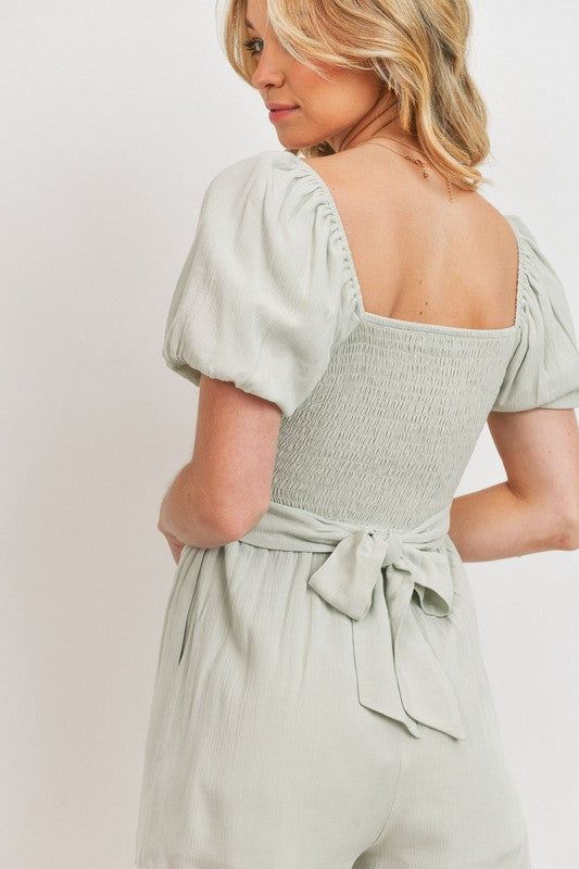sage puff sleeve knotted romper