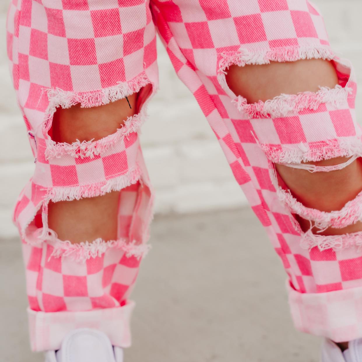 pink checkered distressed jeans