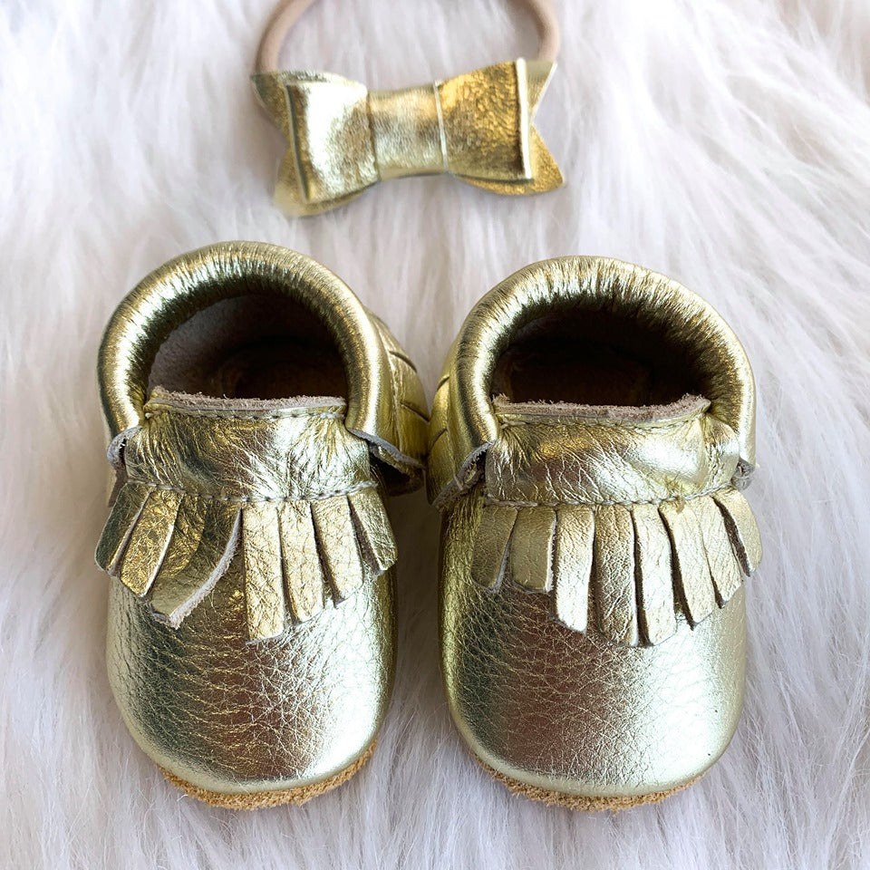 gold baby moccasins