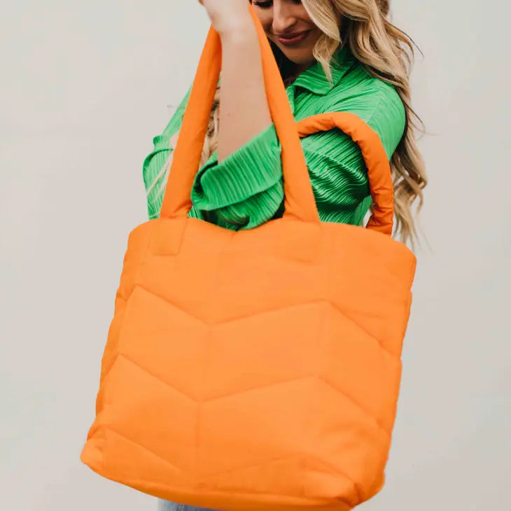 naomi orange puffer bag
